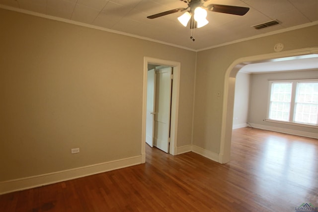 unfurnished room featuring hardwood / wood-style floors, ornamental molding, and ceiling fan