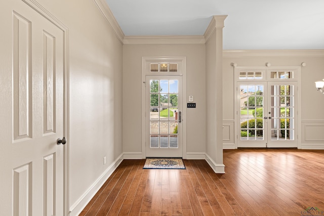 entryway featuring baseboards, dark wood-style flooring, crown molding, and french doors