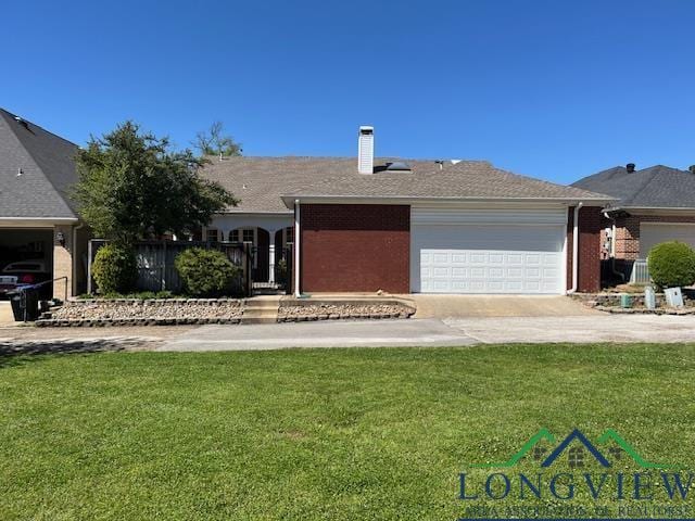 ranch-style home featuring a front yard, driveway, a chimney, and an attached garage