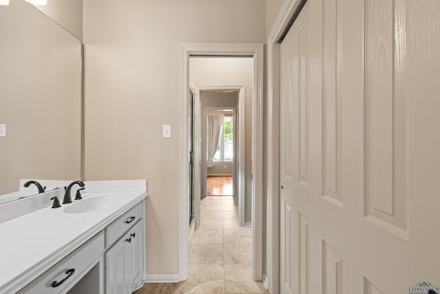 bathroom featuring vanity and baseboards