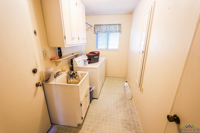 laundry area featuring cabinets and independent washer and dryer