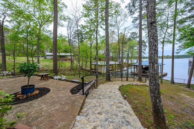 exterior space featuring a dock and a water view