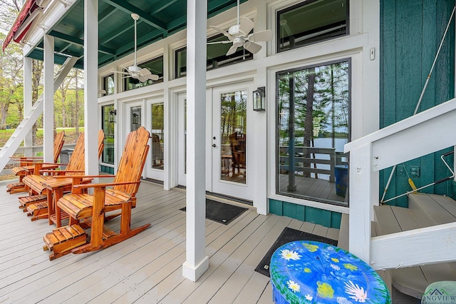 wooden deck featuring ceiling fan