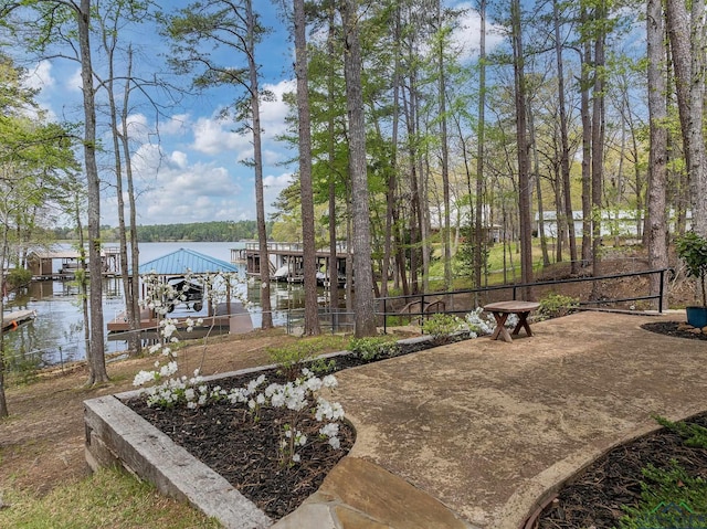 exterior space with a water view and a dock