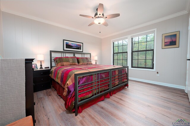 bedroom featuring ceiling fan, light hardwood / wood-style flooring, and ornamental molding