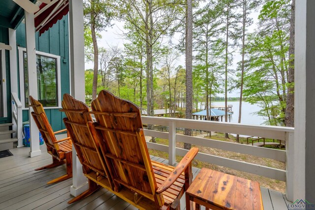 wooden deck with a water view