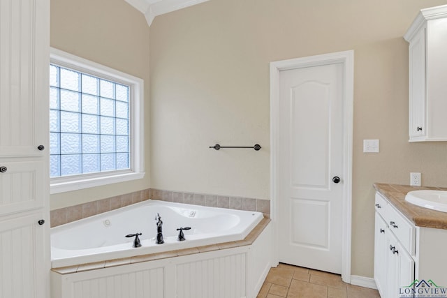 bathroom featuring a bath, vanity, and ornamental molding