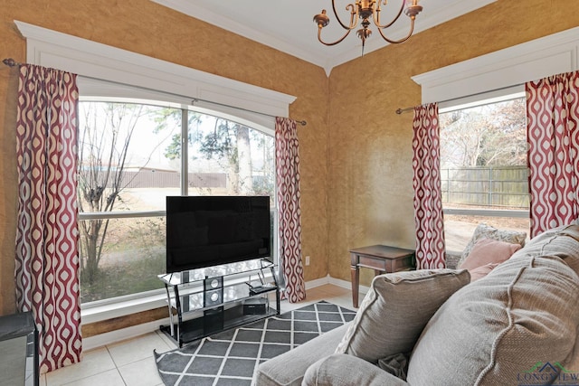 living room featuring light tile patterned flooring, a healthy amount of sunlight, an inviting chandelier, and ornamental molding