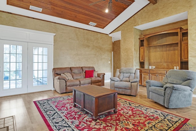 living room featuring ceiling fan, high vaulted ceiling, wooden ceiling, and light hardwood / wood-style floors