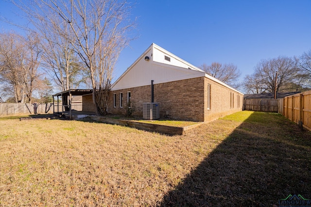 back of house with a lawn and cooling unit