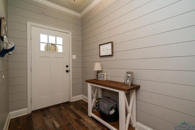 foyer with crown molding and dark hardwood / wood-style floors