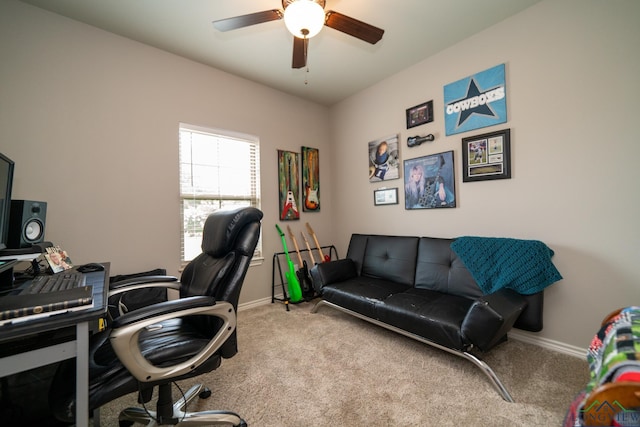 carpeted office featuring ceiling fan