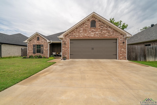 view of front facade with a garage and a front lawn