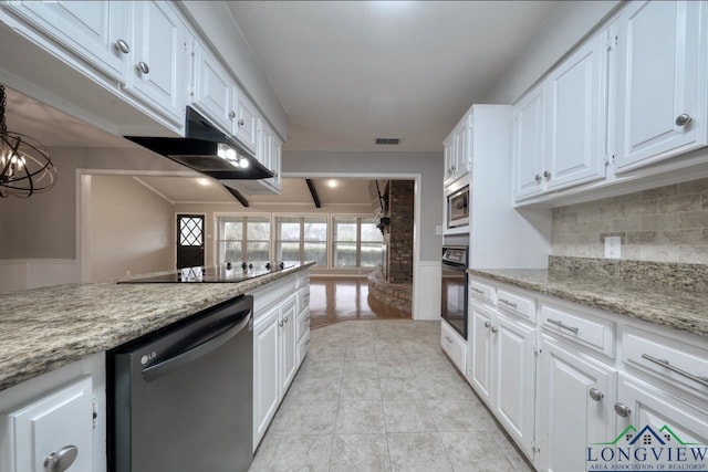 kitchen featuring black appliances, white cabinetry, tasteful backsplash, a chandelier, and light stone counters