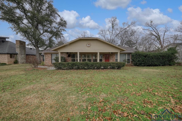 ranch-style home with a front lawn