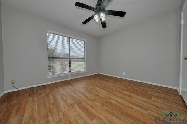 unfurnished room with ceiling fan and light wood-type flooring