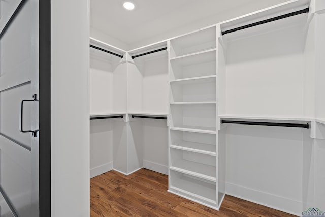330 Forest Hls, Hallsville, TX 75650 - walk in closet with wood finished floors