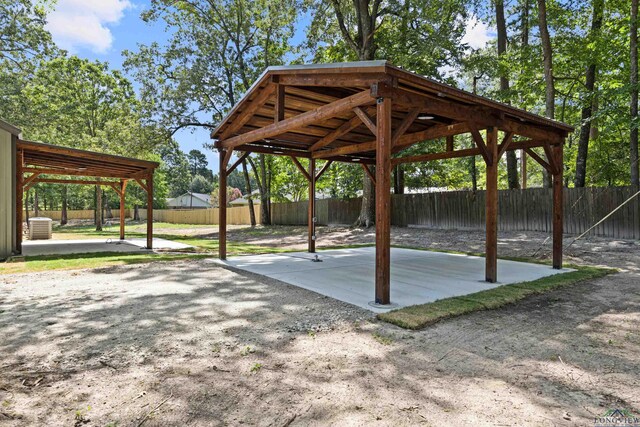 330 Forest Hls, Hallsville, TX 75650 - view of home's community with a patio area, a fenced backyard, and a gazebo