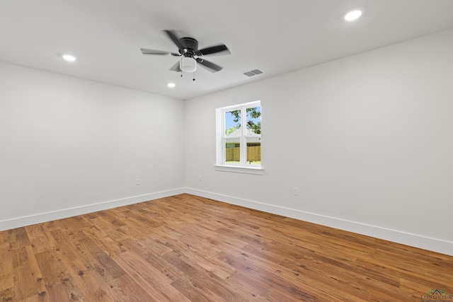330 Forest Hls, Hallsville, TX 75650 - unfurnished room featuring light wood-style flooring, a ceiling fan, and recessed lighting