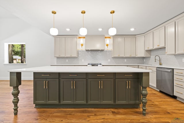 330 Forest Hls, Hallsville, TX 75650 - kitchen featuring stainless steel appliances, light countertops, range hood, a kitchen island, and backsplash