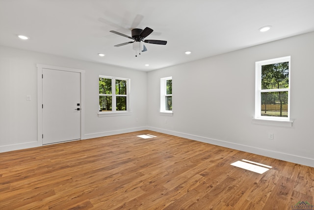 330 Forest Hls, Hallsville, TX 75650 - empty room featuring healthy amount of natural light, light wood-type flooring, a ceiling fan, and recessed lighting