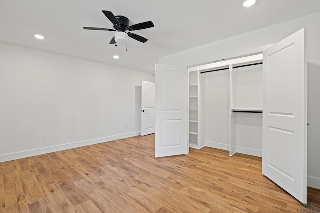 330 Forest Hls, Hallsville, TX 75650 - unfurnished bedroom featuring light wood-style flooring, recessed lighting, a ceiling fan, and a closet
