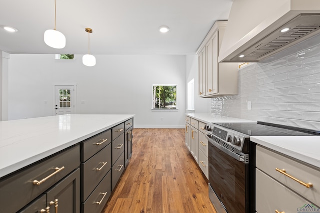 330 Forest Hls, Hallsville, TX 75650 - kitchen with stainless steel electric range oven, wall chimney range hood, decorative backsplash, light countertops, and recessed lighting