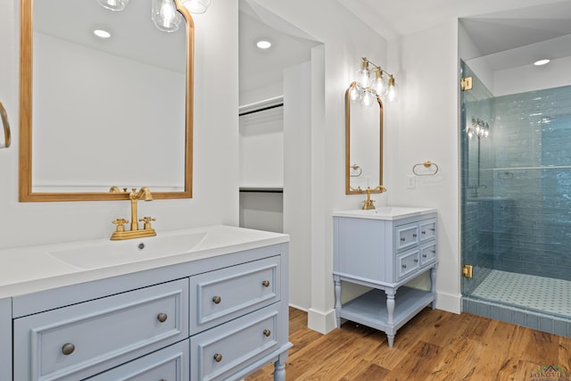 330 Forest Hls, Hallsville, TX 75650 - bathroom featuring a stall shower, wood finished floors, vanity, and recessed lighting