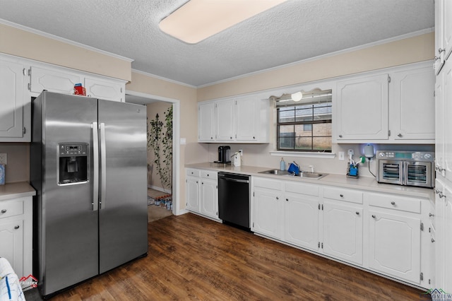 kitchen featuring white cabinetry, dishwasher, sink, stainless steel fridge, and a textured ceiling