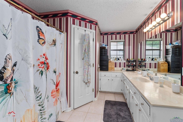 bathroom featuring tile patterned floors, a shower with curtain, vanity, and a textured ceiling