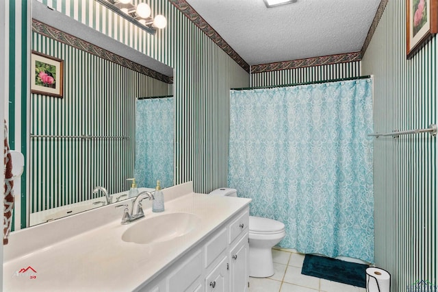 bathroom with vanity, tile patterned flooring, toilet, a textured ceiling, and curtained shower