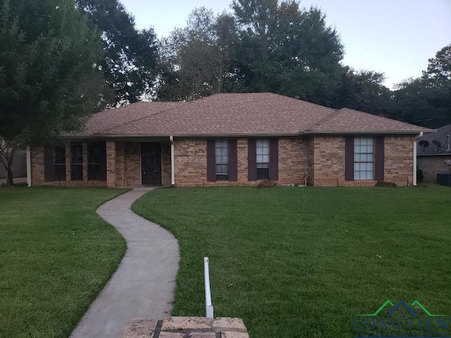 single story home with a front yard