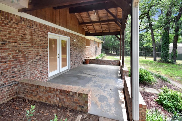 view of patio / terrace with fence and french doors