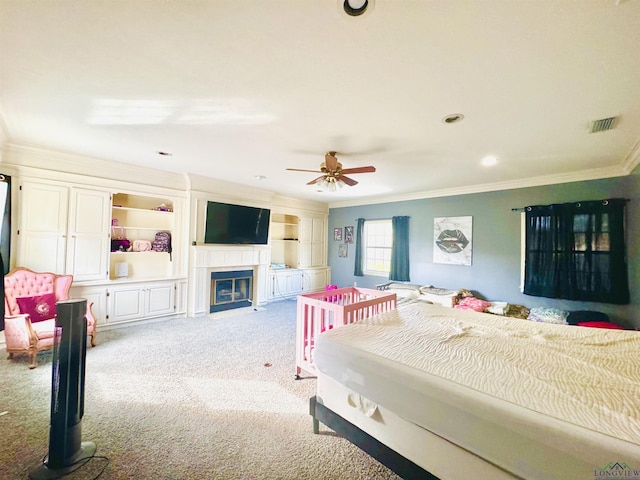 bedroom with ceiling fan, light carpet, and ornamental molding