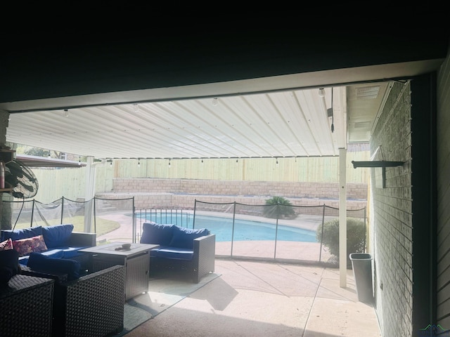 view of patio / terrace with a fenced in pool and an outdoor hangout area