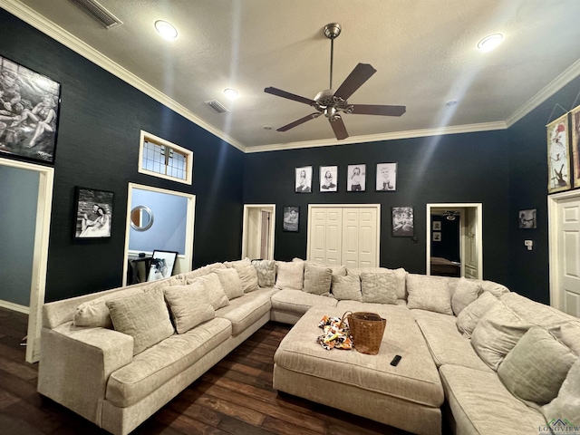 living room featuring dark hardwood / wood-style floors, ceiling fan, and ornamental molding