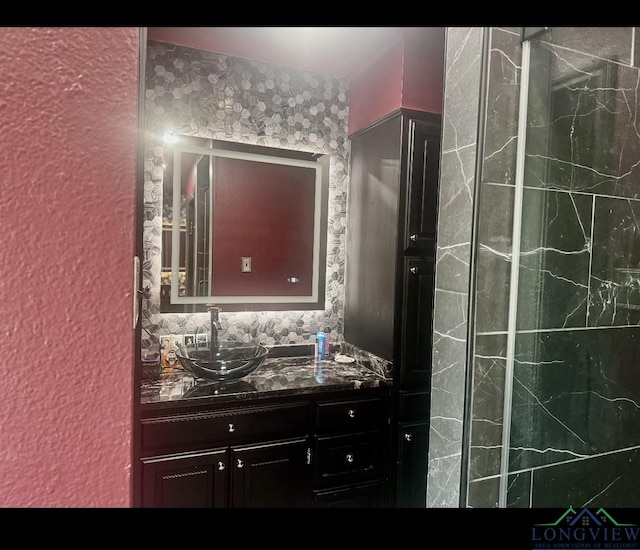 bathroom with tasteful backsplash and vanity