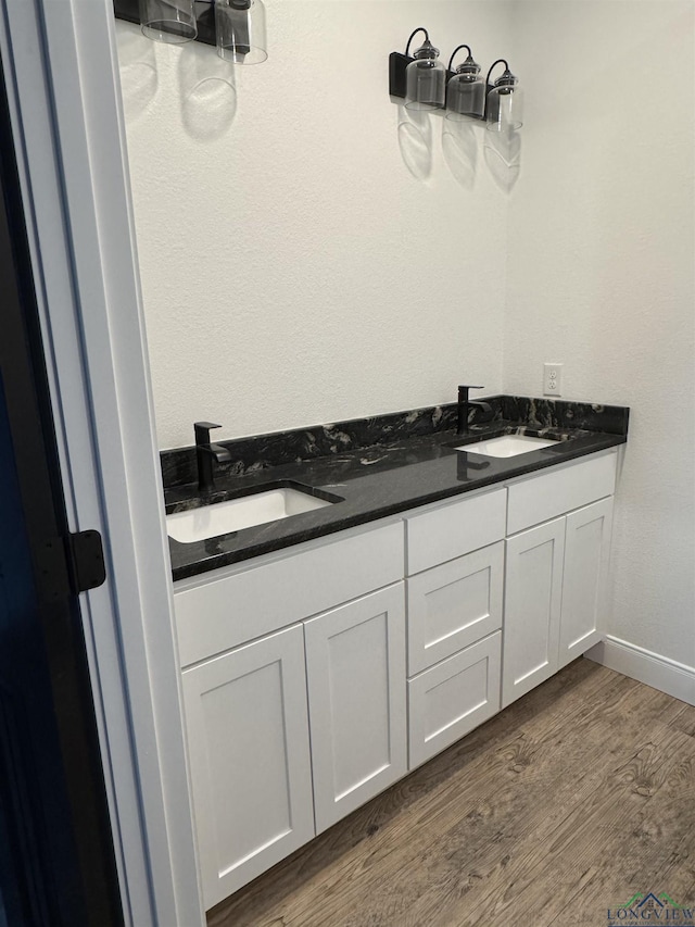 bathroom with wood-type flooring and vanity