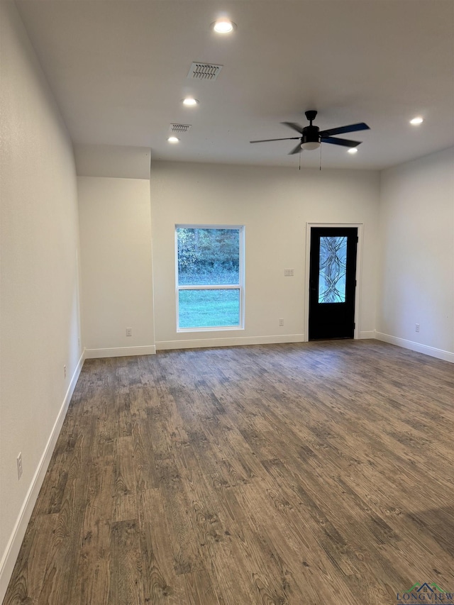 interior space featuring ceiling fan and dark wood-type flooring