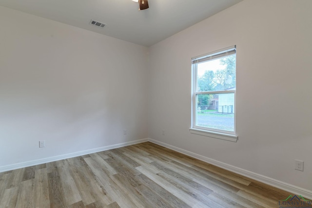 unfurnished room with ceiling fan and light wood-type flooring