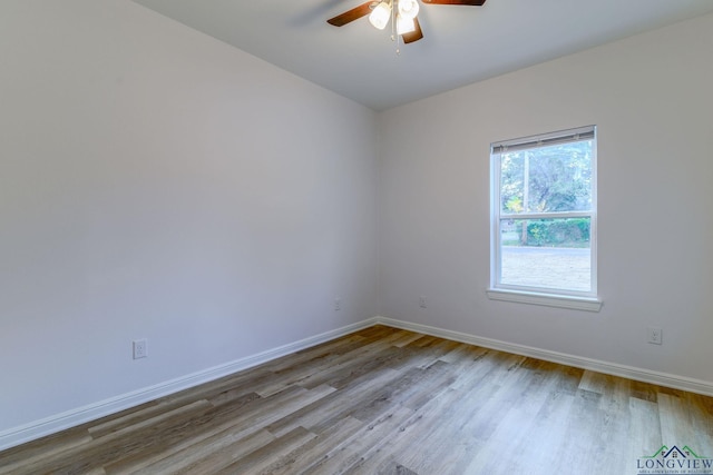 empty room featuring ceiling fan and light hardwood / wood-style flooring