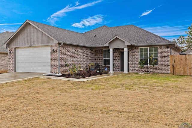 ranch-style home featuring a garage and a front lawn