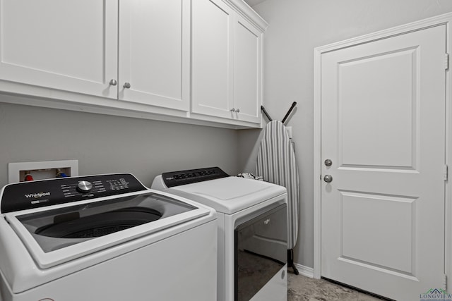 laundry area featuring cabinets and independent washer and dryer