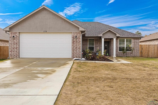 view of front facade featuring a garage and a front yard