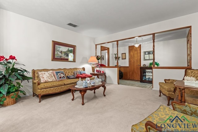 living room featuring light carpet