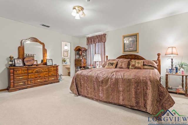 bedroom featuring light colored carpet