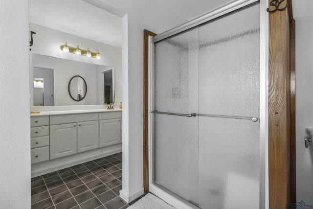 bathroom featuring vanity, tile patterned floors, and an enclosed shower