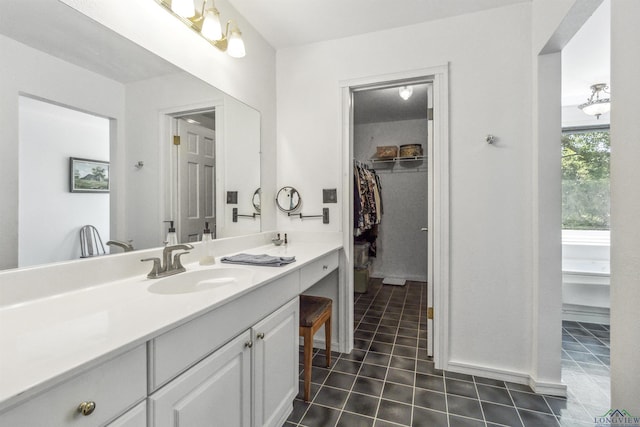 bathroom with vanity and tile patterned floors