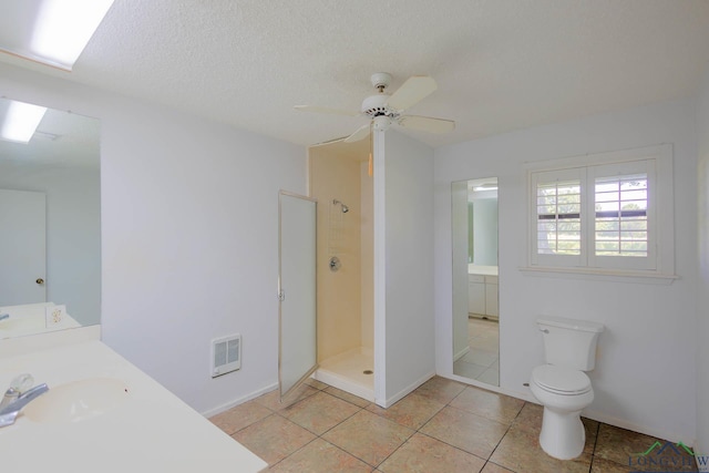 7876 Green Hills Rd, Gilmer, TX 75645 - full bath with walk in shower, vanity, toilet, heating unit, and tile patterned floors