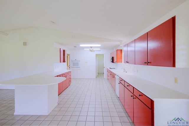 7876 Green Hills Rd, Gilmer, TX 75645 - kitchen featuring a peninsula, red cabinetry, light countertops, ceiling fan, and a sink